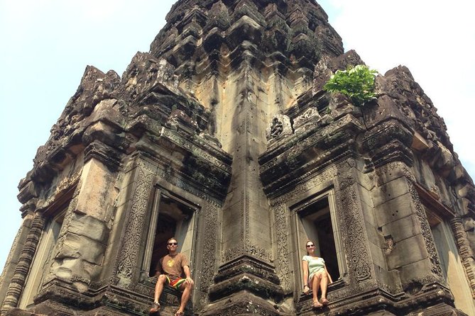 2-D Angkor temple tour with one sunrise in A/C vehicle and guide. - Angkor Thom and the Victory Gate: entering with context