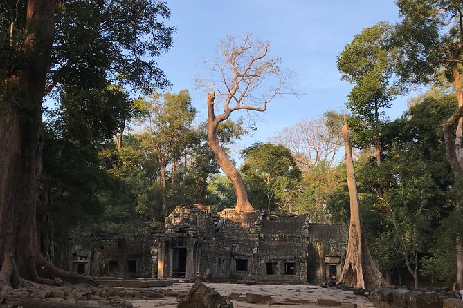 Angkor Jeep Tour with Sunset & Sunrise - Angkor Thom and Bayon: faces, towers, and daily life carved in stone