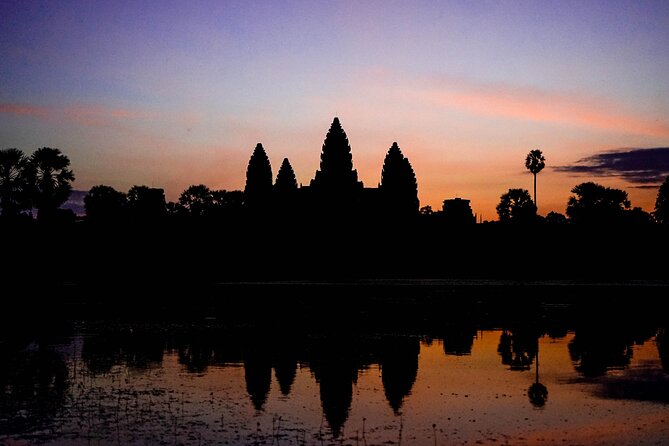 Angkor Sunrise Vespa Tour / Tuk Tuk or Car - Angkor Thom and Bayon: the giant faces and a ride that keeps you moving