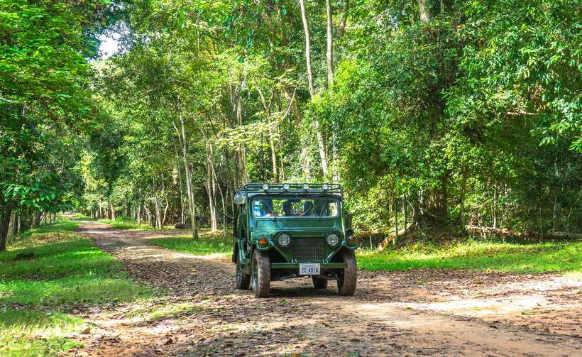 Angkor Wat: Guided Jeep Tour Inclusive lunch at local house - Angkor Thom’s carved gate with elephants and giant faces