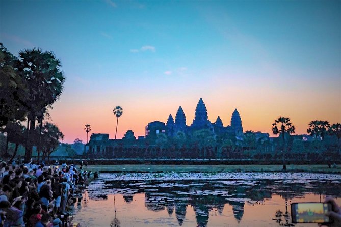 Angkor Wat Highlights and Sunrise Guided Tour from Siem Reap - Entering Angkor Wat at sunrise, from darkness to gold