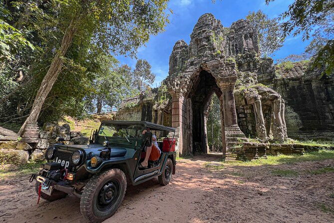 Angkor Wat Sunrise and Market Tour by Jeep - Ta Prohm: jungle texture, huge roots, and the iconic look