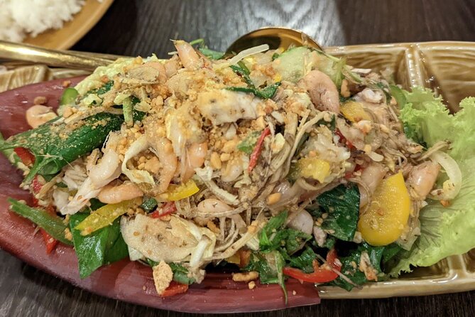 Phnom Penh Authentic Evening Food Tour 100% By Local - Royal Palace area: rice pancakes with peanut sauce and fresh herbs