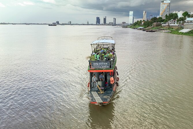 Phnom Penh Bike & Boat Sunset Tour / E-Bike Available - Silk Island Community Center and Silk House: see weaving, know what costs extra