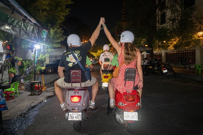 Phnom Penh Evening Foodie Vespa Tour / Tuk Tuk Available - Stop 1: Phnom Penh nightlife from the back of a Vespa