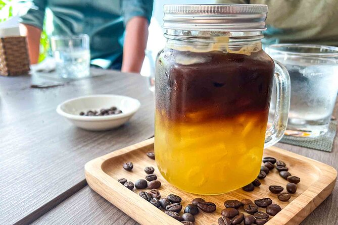 Phnom Penh Morning Market & Food Tour by Tuktuk - Includes All Food & Drinks! - Stop 6: Kompi Coffee finish, tied to a National Barista Gold Medal
