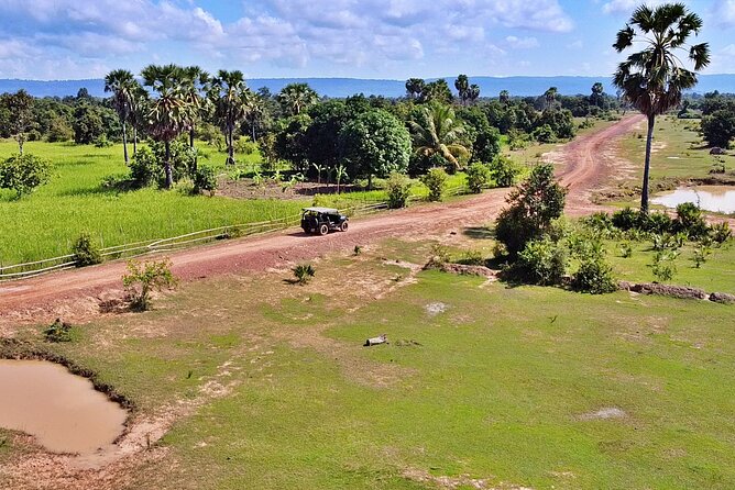Private Countryside & Floating Village Jeep Tour from Siem Reap - Bakong by bike: rice fields, palms, and a real market stop
