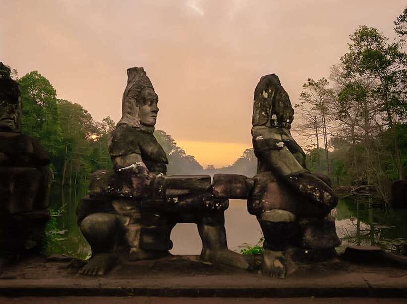 Siem Reap: Angkor Wat Sunrise or Sunset Guided Group Tour - Angkor Thom and Bayon: the jungle temple mood and the smiling faces