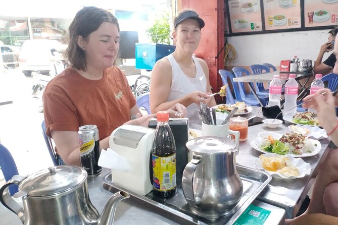 Siem Reap Authentic Breakfast and Market Tour - Stop 4 at Phsar Leu Thom Thmey: choosing Cambodian sweets and getting photos