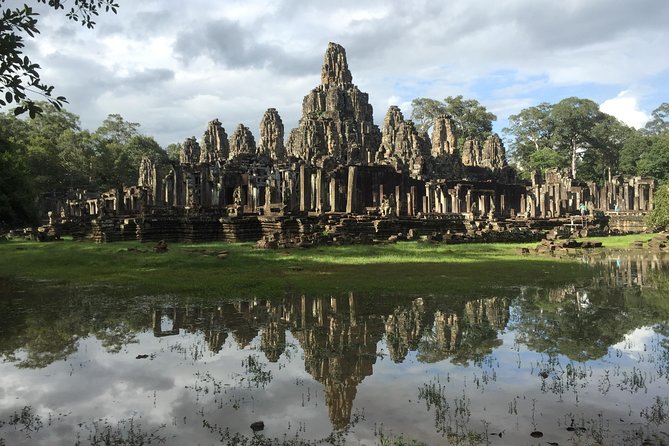 Unveil The Magic Of Angkor Wat Sunset In A Day Personalized Tours - Stop 2: Bayon Temple, Smiling Faces in the Heart of Angkor Thom